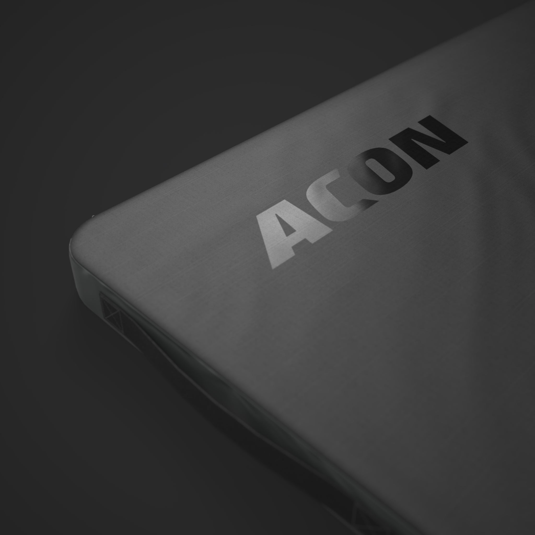 A closeup to the black Acon logo in Black Edition Acon Spotting Crash Mat product image against a white background